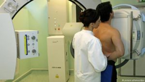 man getting chest X-ray as diagnostic reference levels are lowered